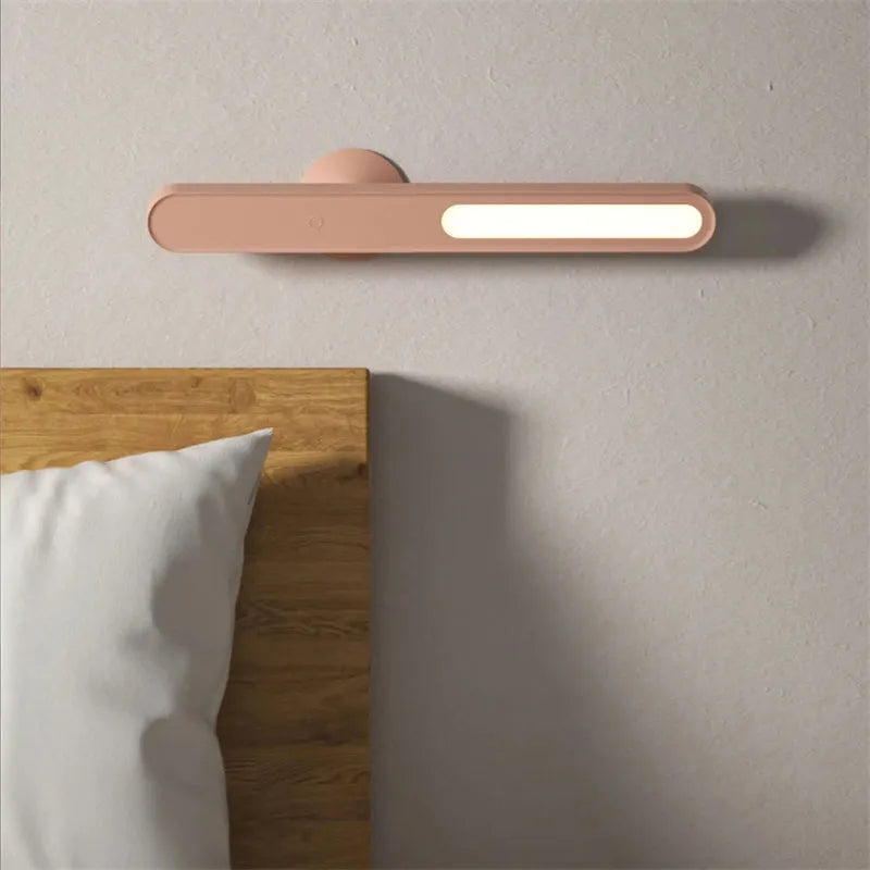 Geometric white desk lamp with magnetic base and USB cable on wooden table