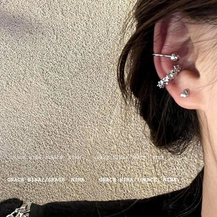 A pair of geometric irregular-shaped alloy earrings with a frosty finish and clip-on fastenings.