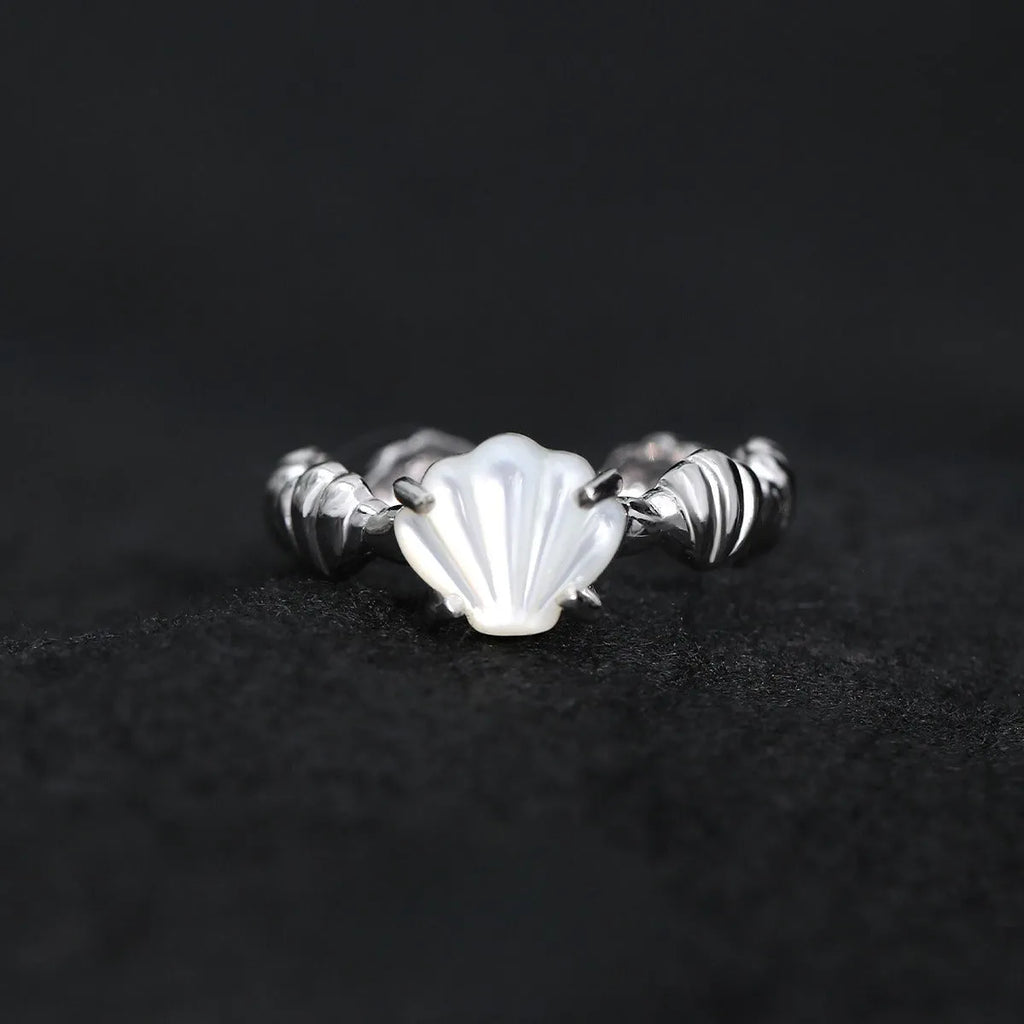 Women's sterling silver ring with shell element, tiger eye accents, and adjustable opening in gold electroplated finish