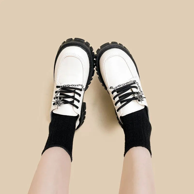 Women's Duke Asterism preppy loafers with a cross shoulder strap and metal detail.