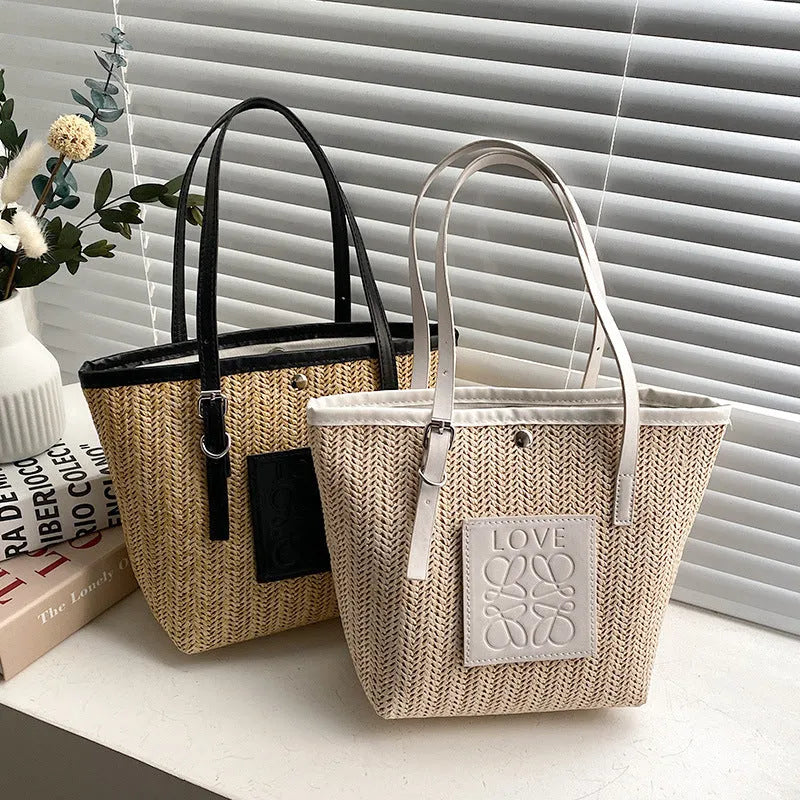 Straw woven women's shoulder bag with retro design showing three-dimensional pockets and 18cm handle