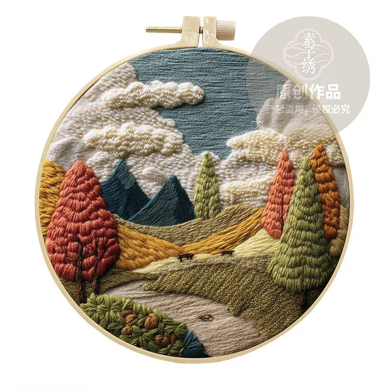 Embroidery DIY kit with landscape printed fabric, bamboo frame, thread, and needles for handmade cloth art