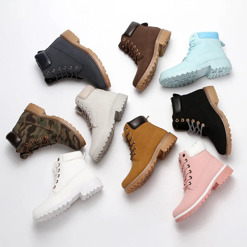 Men's pink high-top Martin boots with round toe and front lace-up on a flat bottom.