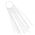 Gold rhinestone mesh headband with a tassel detail on a model's hair.