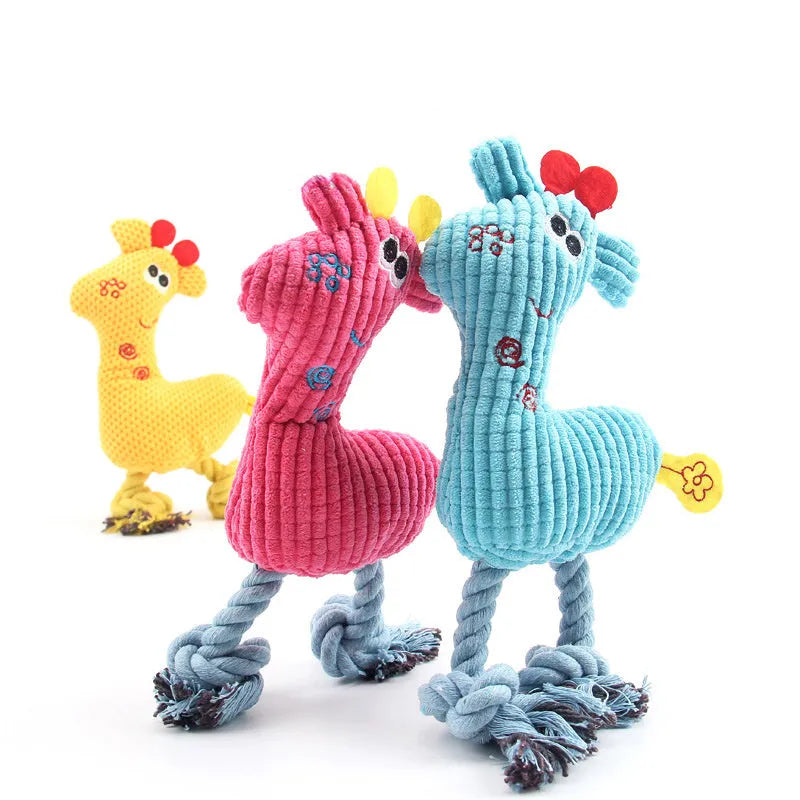Blue deer shaped plush dog toy with corn grain texture, shown with a dog.