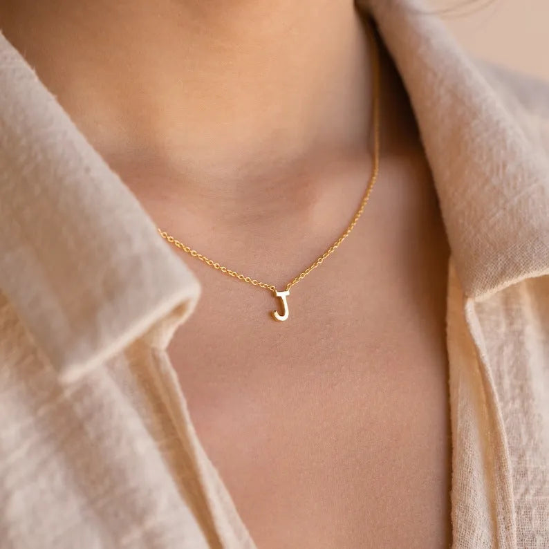Stainless steel letter necklace with mixed gem inlaid pendant on an adjustable O-ring chain in silver finish