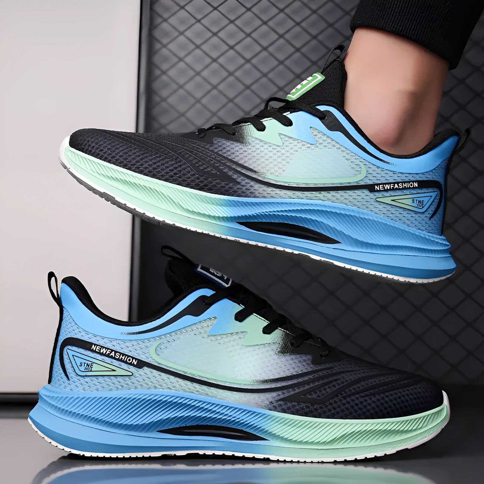 Men's low-top casual trainers with woven mesh upper and rubber sole in black, blue-grey, and green-grey colours.