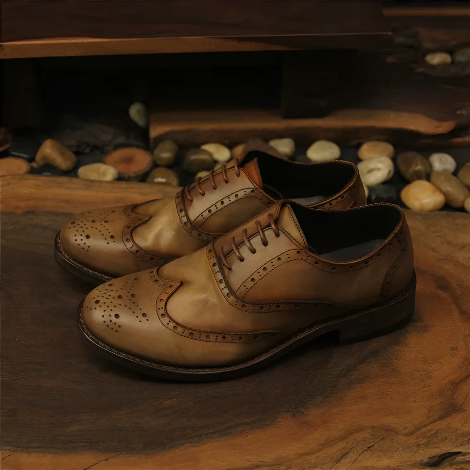 Men's light brown distressed leather shoes with vintage engraved detailing and round toe