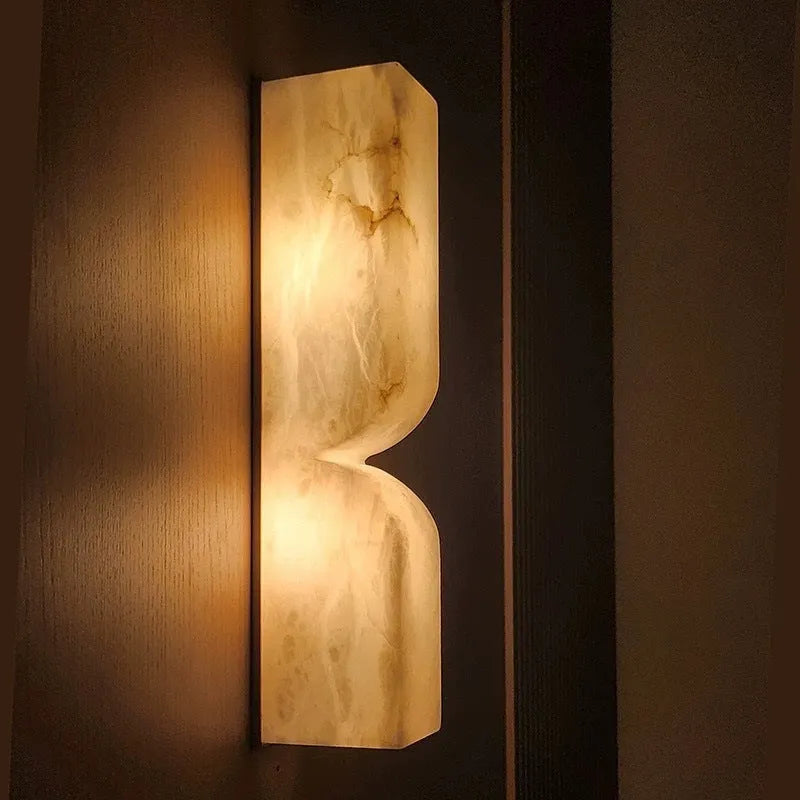 Modern Nordic-style copper wall lamp strip for bedside lighting.