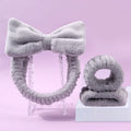 Facial brush and coral fleece hair band set in multiple colours including purple, gray, white, and pink