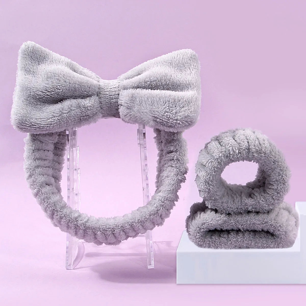 Facial brush and coral fleece hair band set in multiple colours including purple, gray, white, and pink