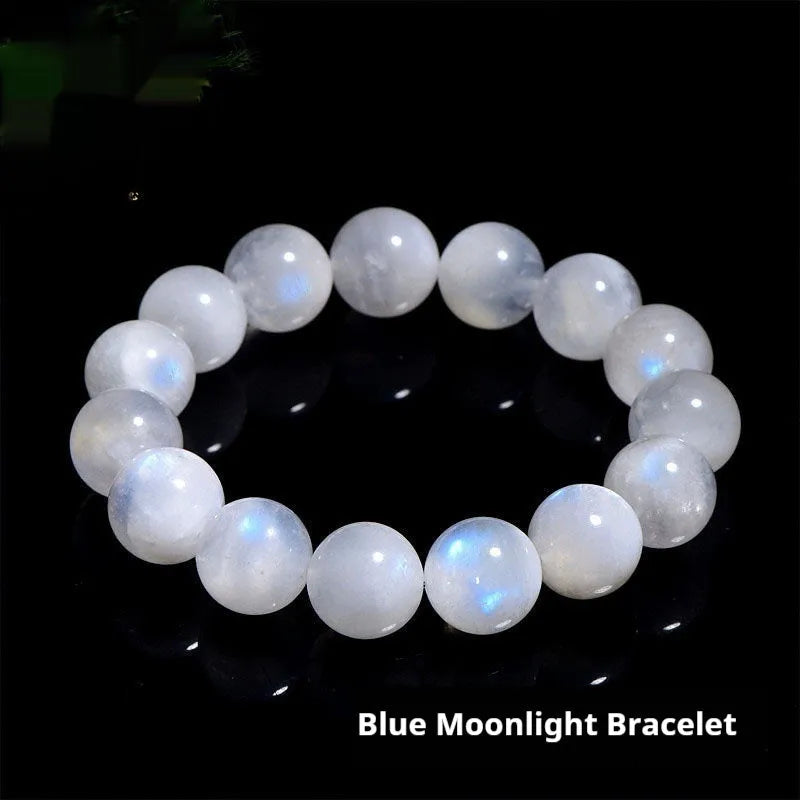 Polished natural blue moonlight moonstone round bead bracelet on white background, showing geometric facets.