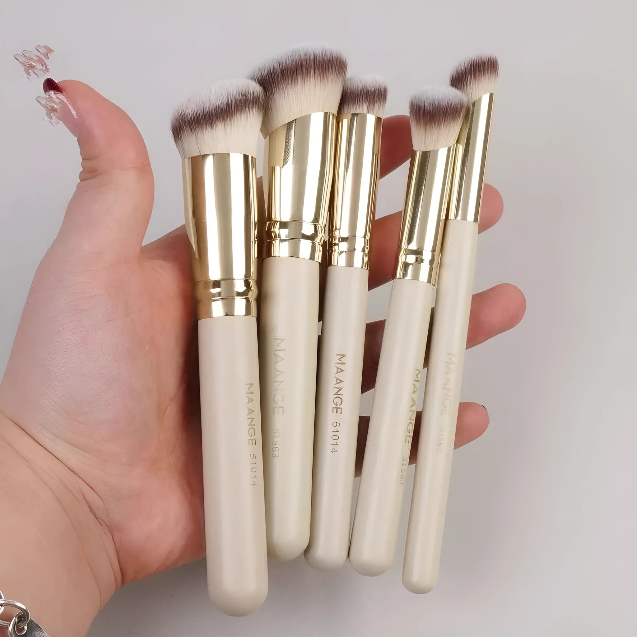 Five apricot makeup brushes with angled blush brush for cheekbone contouring