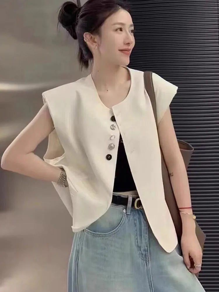 Women's loose-fitting solid colour polyester vest with a pocket, shown in milky white.
