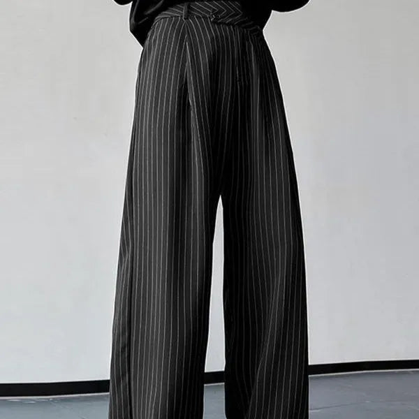 Black men's trousers with vertical striped pleated design showing elastic casual wear