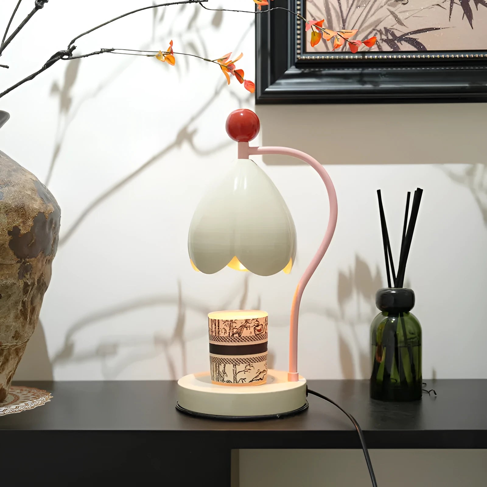 Linglan ancient style cream white melting wax lamp with metal holder on a desk.