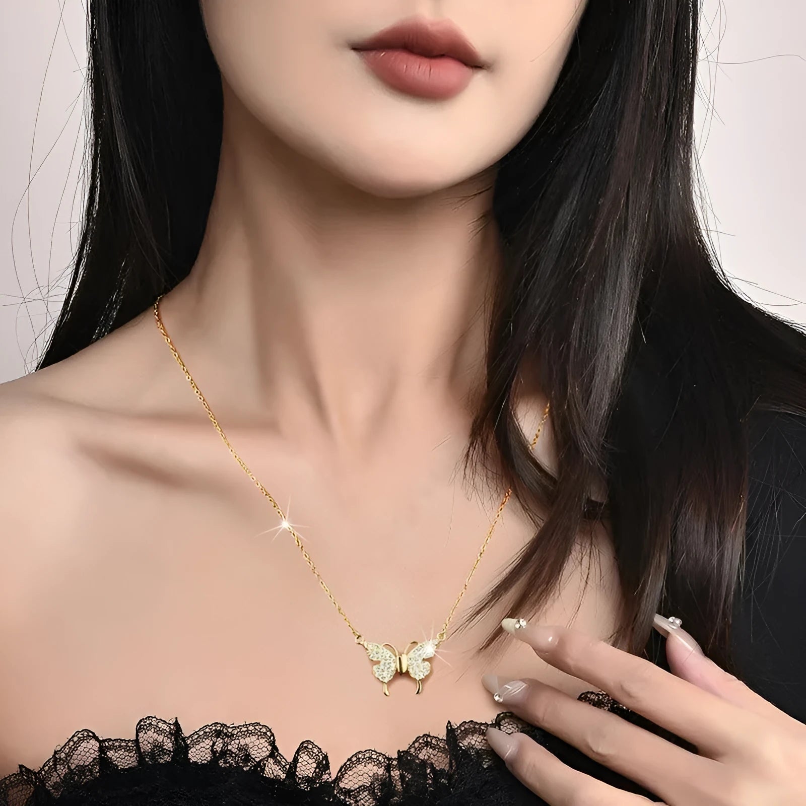 Women's clavicle necklace with magnetic butterfly pendant on twisted chain in gold finish