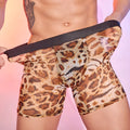 Men's leopard print nylon boxer shorts laid flat, showing the full animal pattern and elastic waistband.