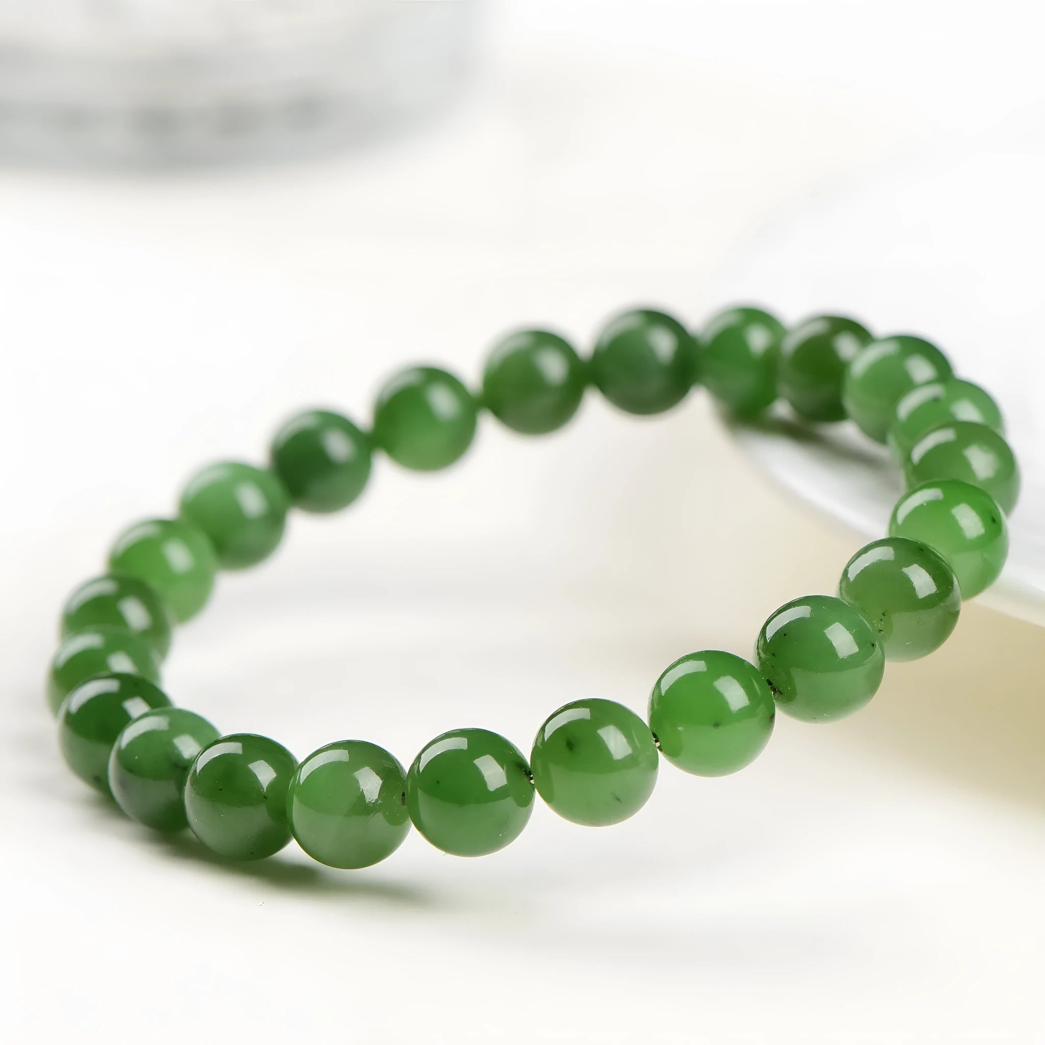 Natural jasper ball bracelet made from polished Hetian jade beads, shown in multiple bead size options.
