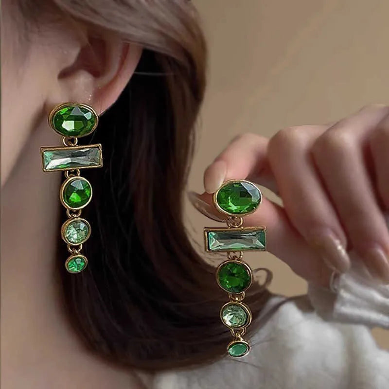 A pair of green gradient geometric alloy earrings with a tassel and inlaid zircon stones in a Chinese retro style.