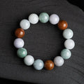 Women's natural Myanmar jade bracelet showing three colours in 13mm round bead design