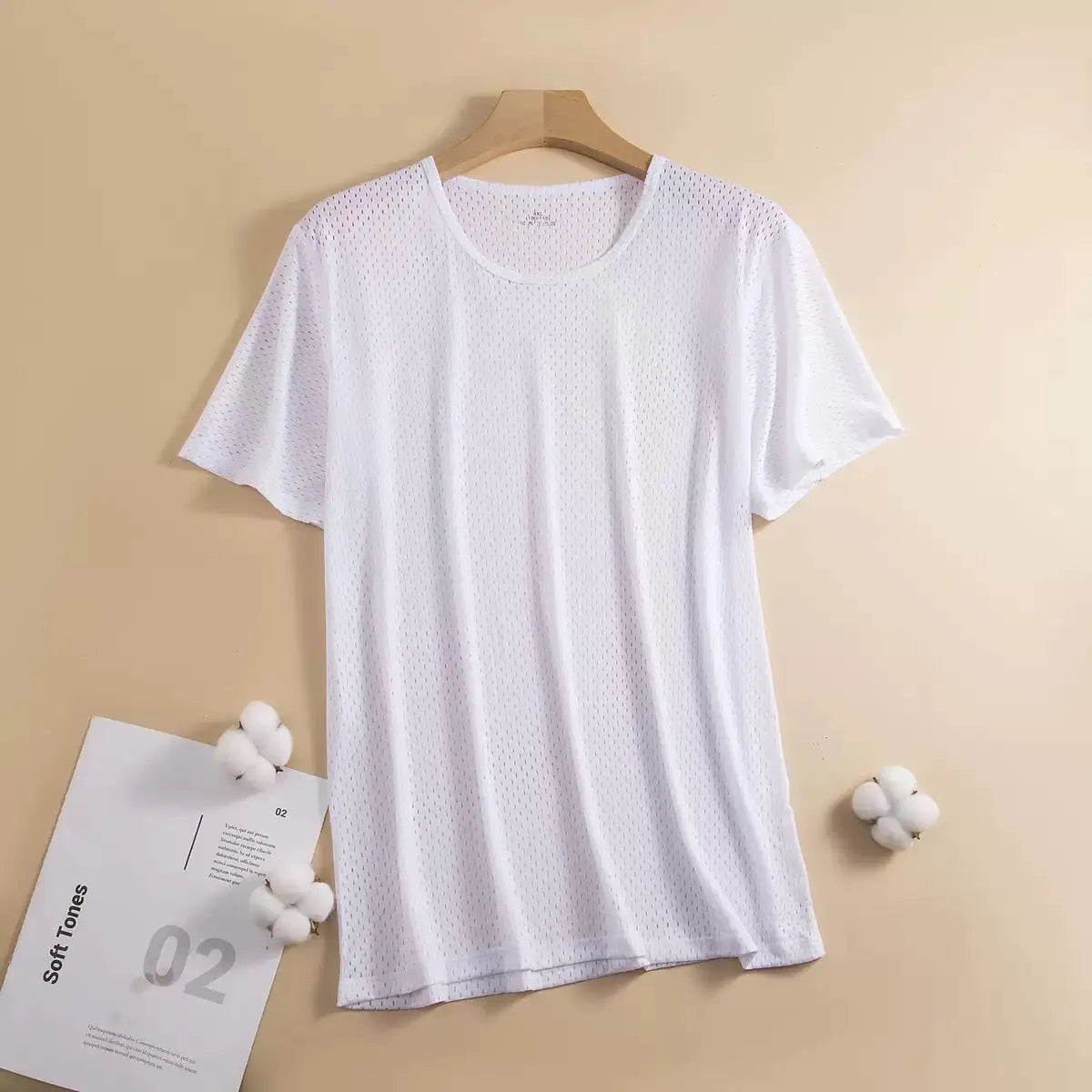 Man wearing a solid colour ice silk short sleeve crew neck T-shirt.