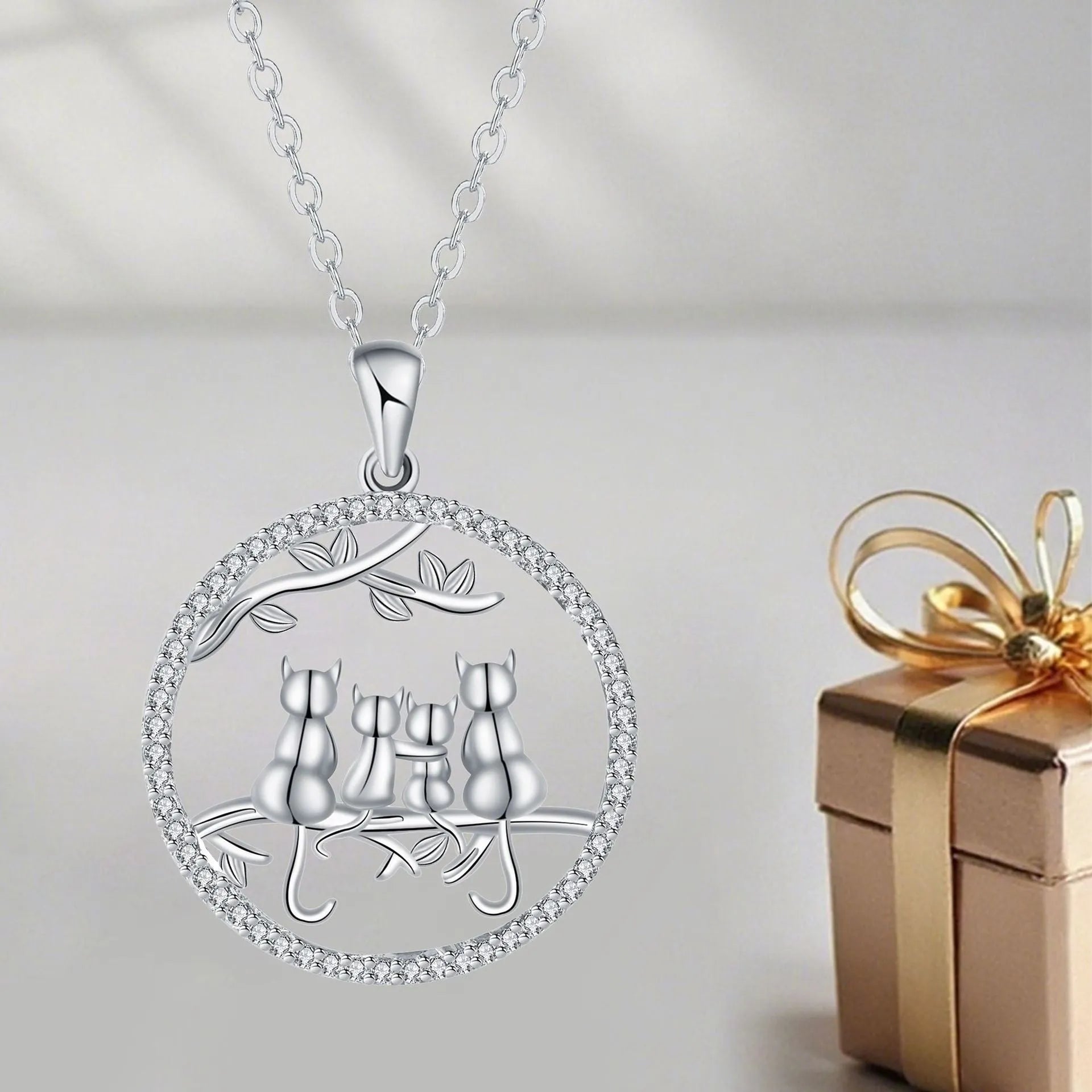 Four kitten pendant necklace on copper cross chain with electroplated finish