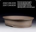 Handmade antique oval purple sand ceramic bonsai pot measuring 25cm by 21cm by 6.3cm