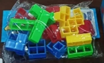 Plastic balance stacking game with coloured blocks on chassis for family play