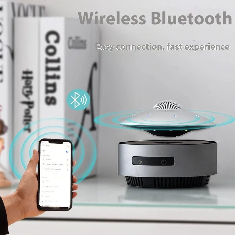 Automatic lifting magnetic levitation Bluetooth speaker with floating orb above a black base.