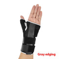 Black carbon fibre sports wrist guard with thumb strap and grey edging for left or right hand wear