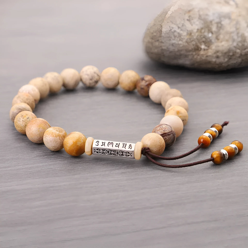 Original design handmade stone bead bracelet in natural wood colour on wrist.