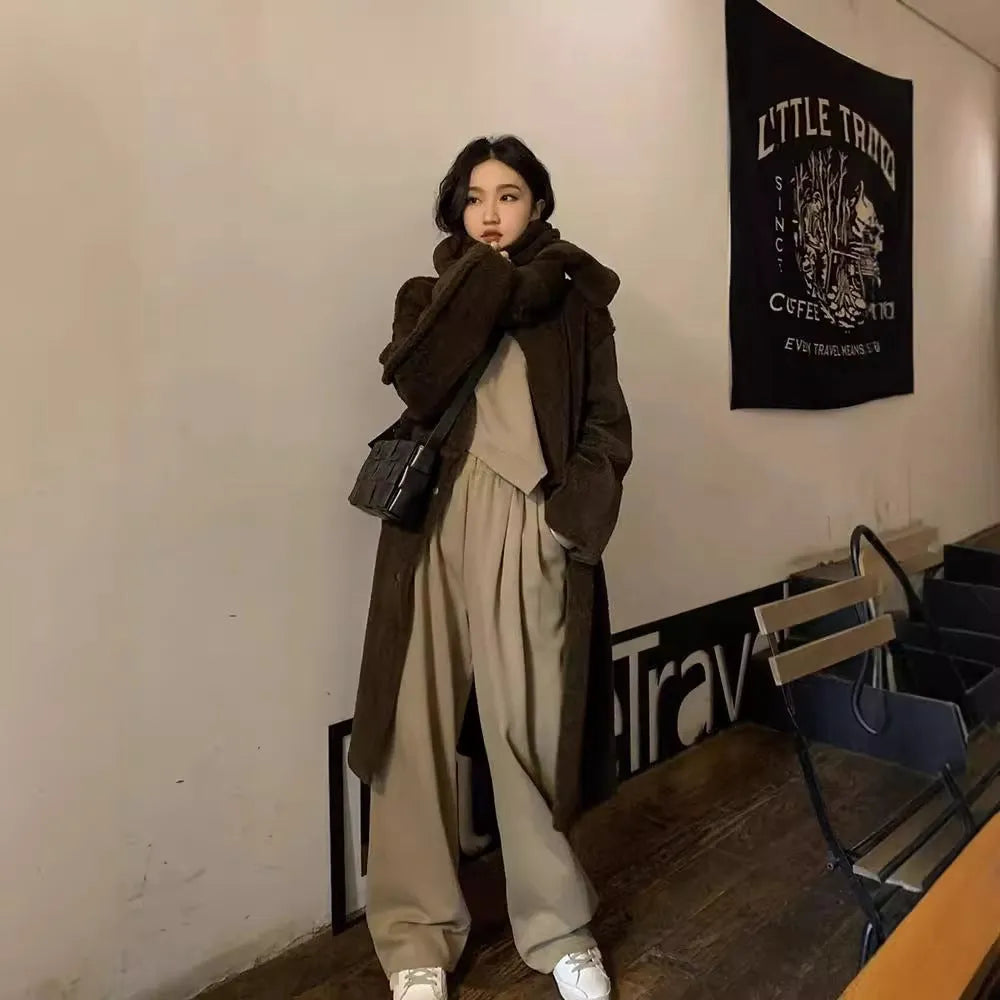 Women's brown loose-fit polyester sports suit set with long sleeves and full-length trousers.