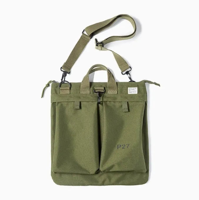 Marden Tooling Helmet canvas messenger crossbody bag in military green, showing vertical square shape and shoulder strap.
