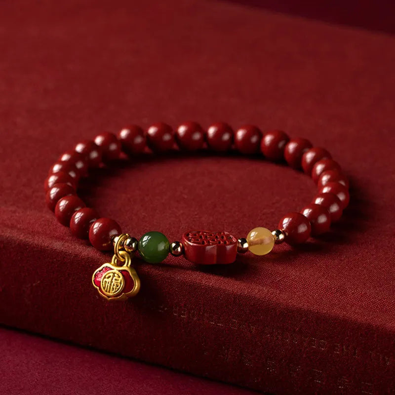 Emperor sandstone bracelet with fu character charm in 6mm and 8mm size options.