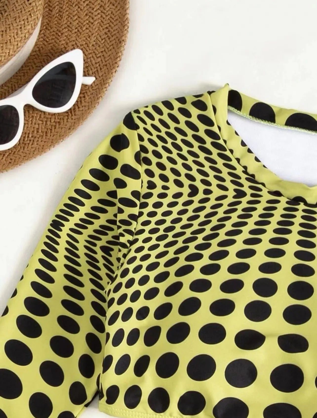 Green and yellow polka dot women's three-piece swimsuit set with bra, bikini top, and skirt.