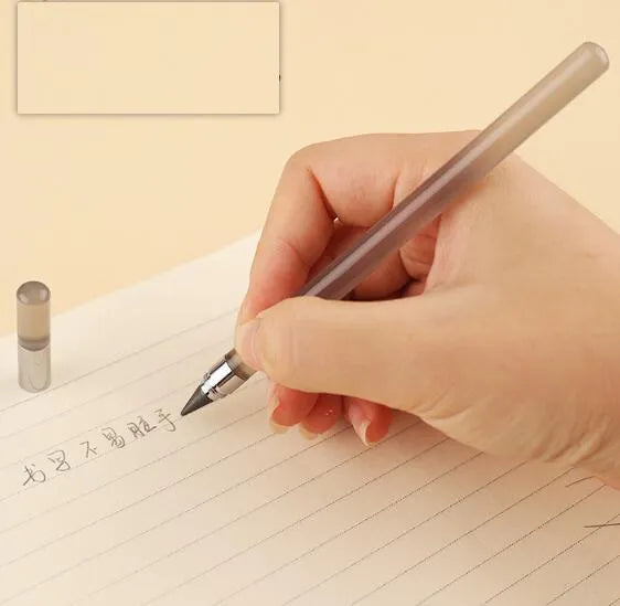 Clear acrylic sharpening-free eternal pencil with alloy tip on a desk