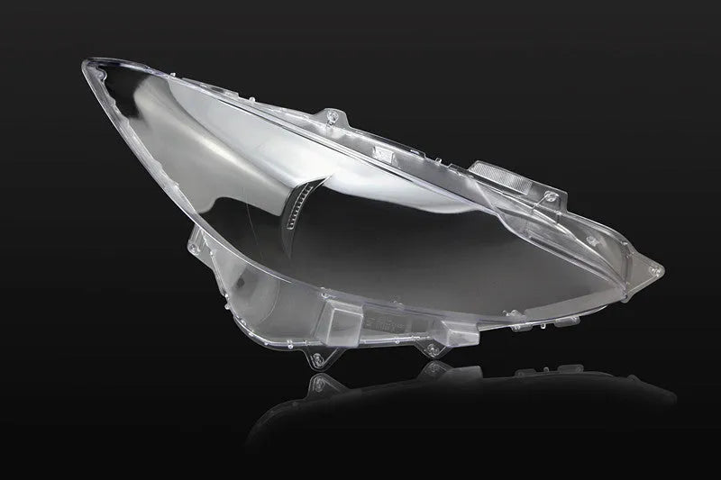 Mazda 3 Exela car headlamp cover replacement part with tube of snake glue adhesive.