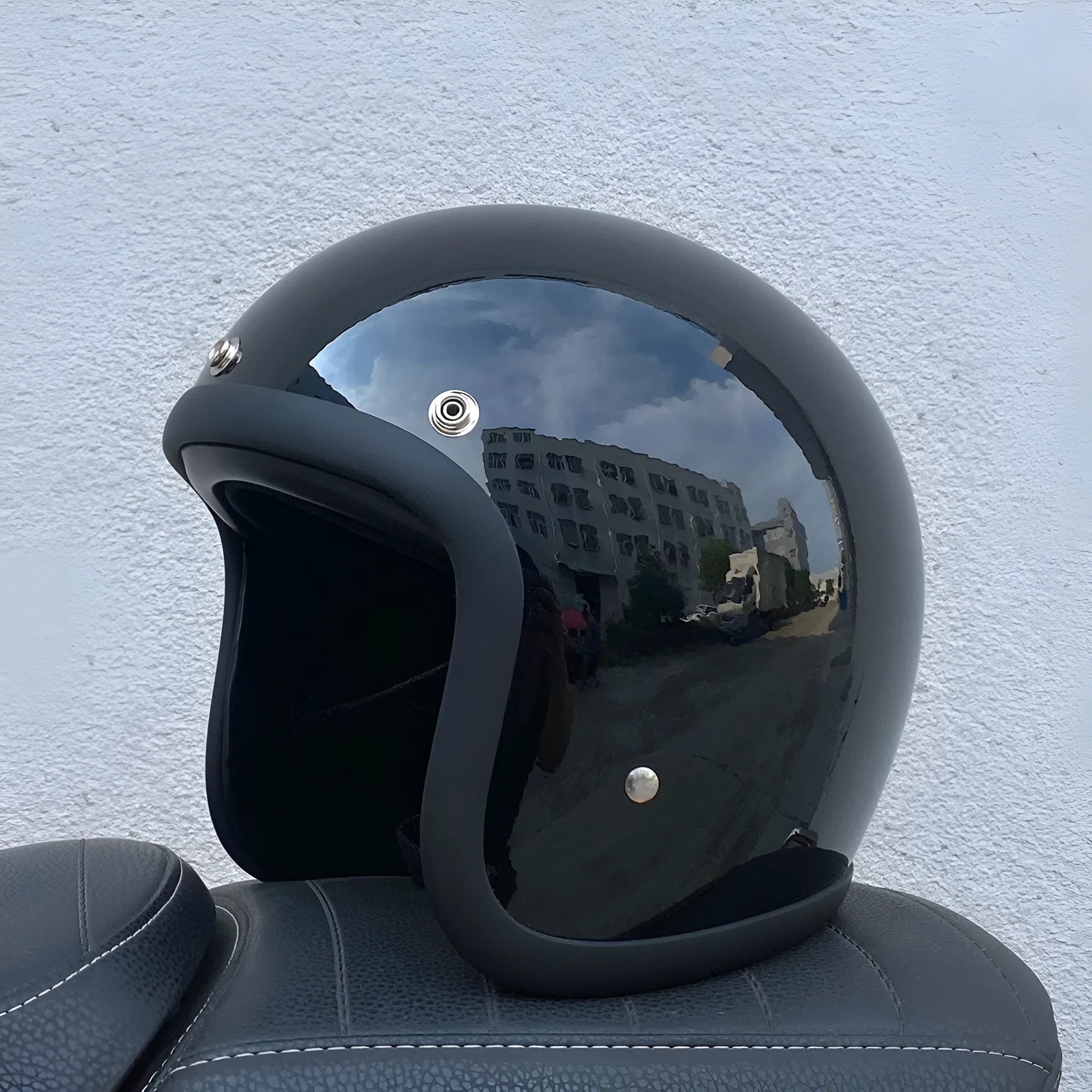 A cement grey retro-style half motorcycle helmet made from FRP glass fibre, shown on a white background.