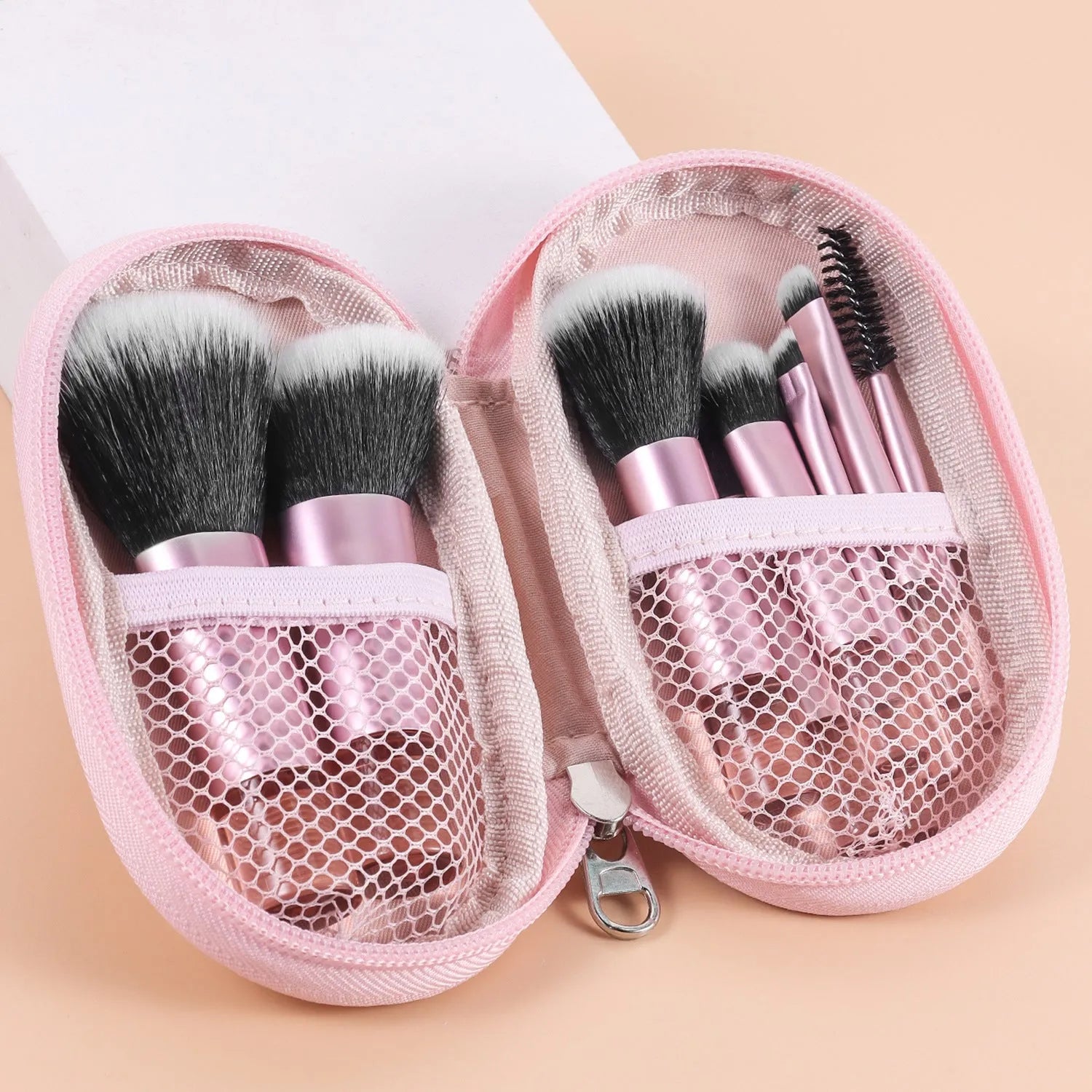 10-piece makeup brush set with fibre bristles, aluminium tubes, and crystal handles, plus a storage bag
