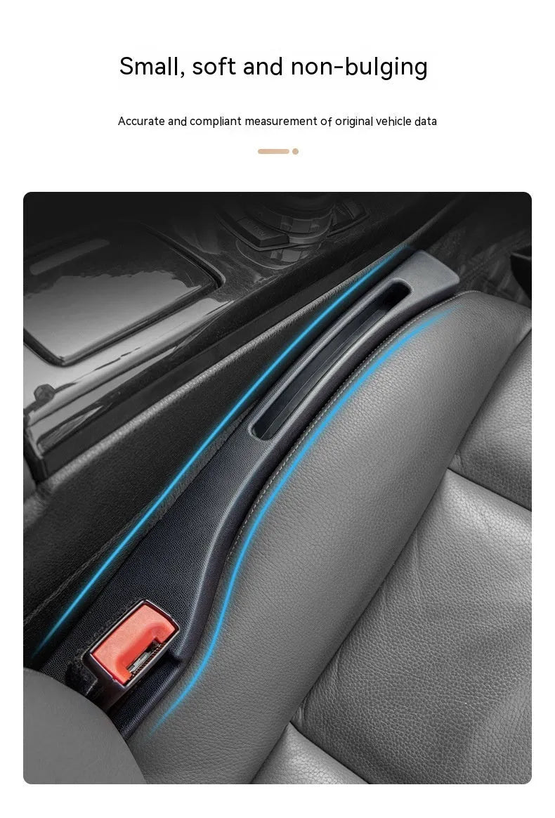 Black plastic car seats gap storage box with handle between driver seat and centre console
