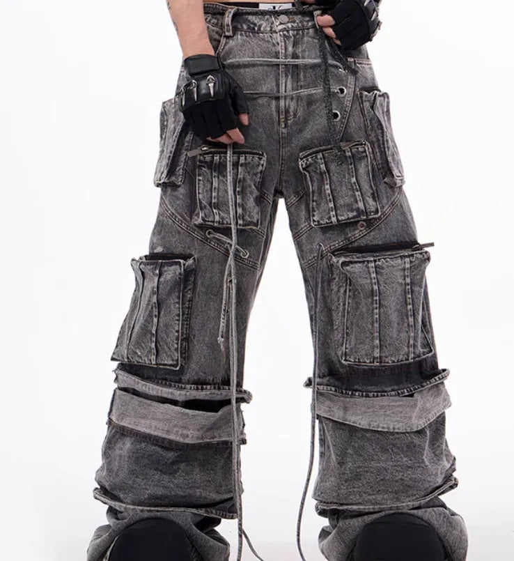 Grey cotton denim overalls with distressed finish and rope stitching on the legs.