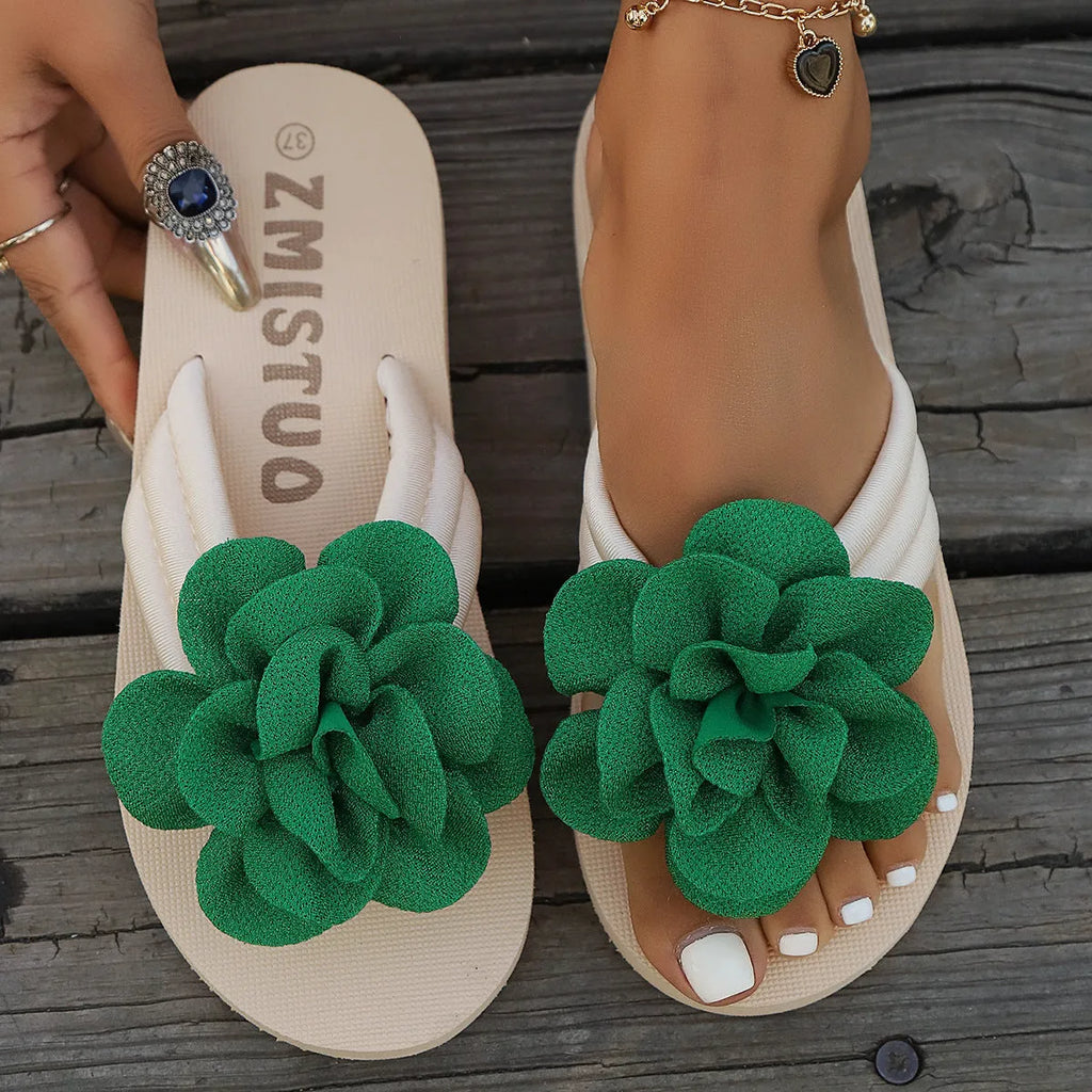Plus size floral flip flop slippers in beige, green, and rose red on a white background.