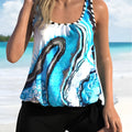 Blue tie-dyed floral pattern women's two-piece swimsuit set with top and shorts on a mannequin.