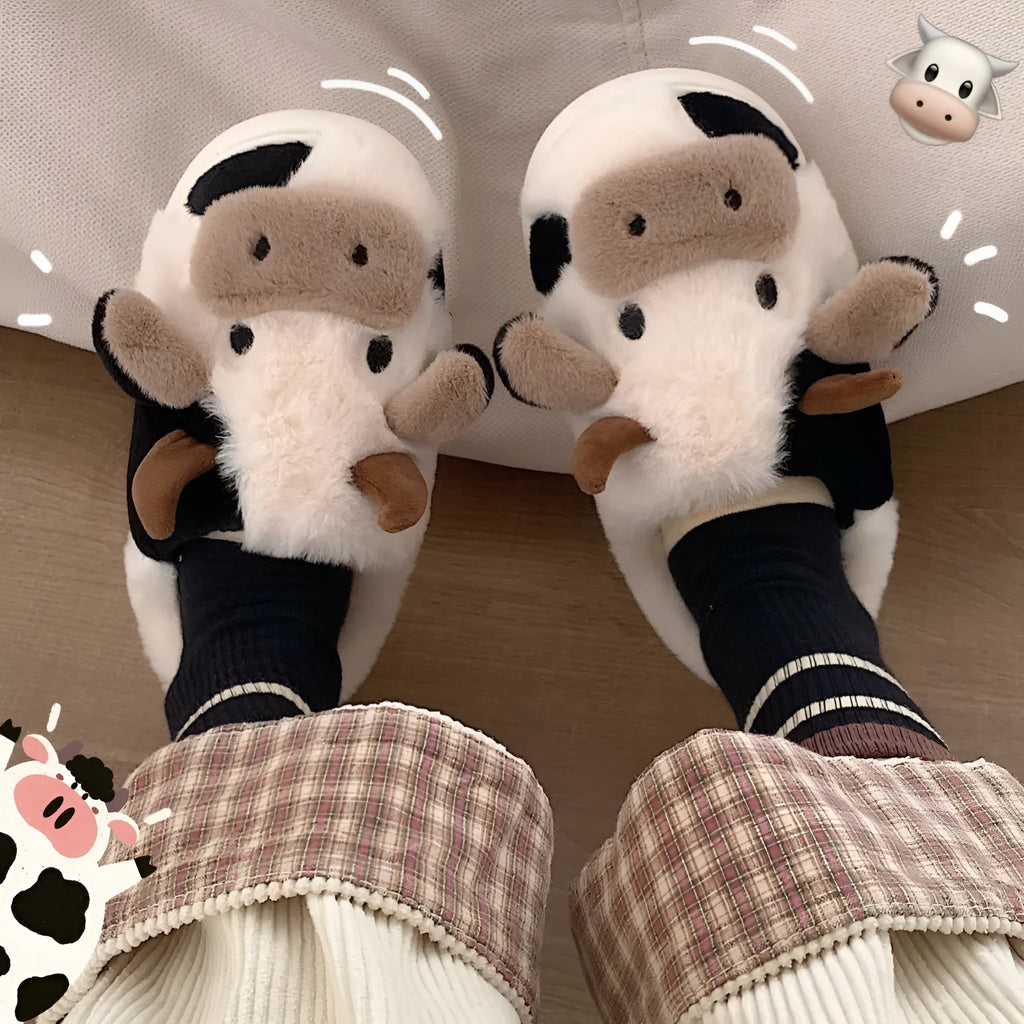 White plush cow-themed house slippers for women with a non-slip textured sole.