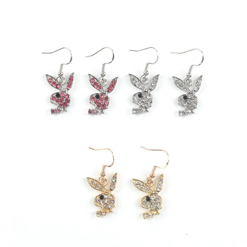 Rabbit stud earrings in silver pink gold colours with cartoon animal design and constellation details