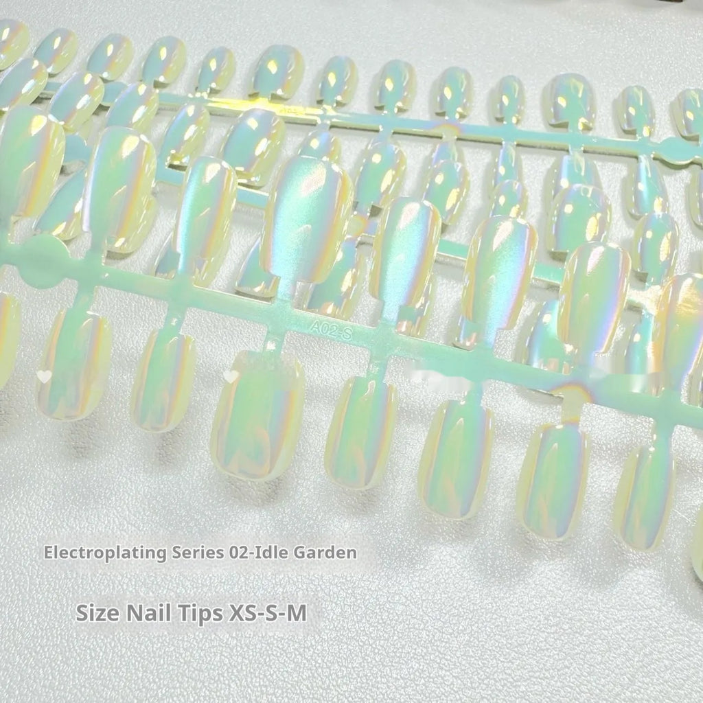 Electroplated Cat's Eye aurora glitter false nails in short ladder shapes on a white background.