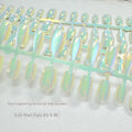 Electroplated Cat's Eye aurora glitter false nails in short ladder shapes on a white background.