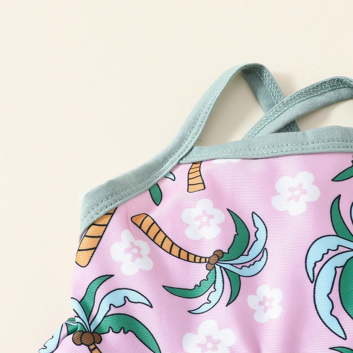 White children's swimsuit set consisting of top and shorts for beach and pool use