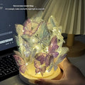 Handmade butterfly night lamp with glass shade on raw wood base measuring 12x15cm